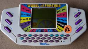 lot 52 image: VINTAGE WHEEL OF FORTUNE HANDHELD DIGITAL GAME