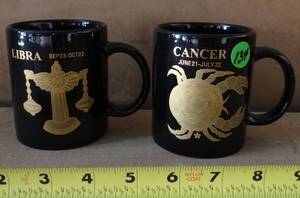 lot 134 image: PAIR OF ZODIAC THEMED COFFEE MUGS