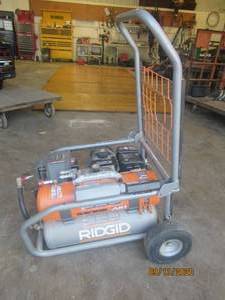 lot 10 image: BRAND NEW NEVER USED RIGID ZERO GRAVITY GAS COMPRESSOR. ITEM IS BRAND NEW NEVER USED NEVER FILLED WITH GAS NEVER TOUCHED