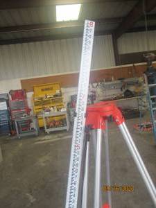 lot 51 image: SURVEYOR TRI-POD AND LEVELING ROD IN BAG (WORKS WITH LOT #50)