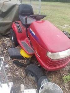 lot 60 image: Riding mowers and chainsaws