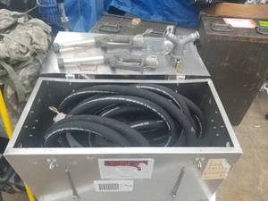 lot 78 image: Metal storage case with gas pump supplies