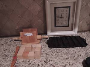 lot 53 image: wooden rolling pin, napkin holder, wooden blocks, cannon wall clock cast iron corn maker