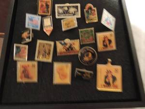 lot 339 image: Postal Service stamp pins x 18 Signlanguage, superman, ignorance, we the people, congrats, teddy bear, love you, I want you, heroes x 2, Cinco de Mayo, customer service, texas, love flag