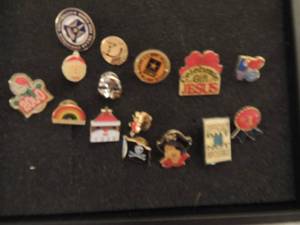 lot 341 image: Lapel pins x 15- Santa 1995 &1998,pirate, snowman 2000, pirate flag, celebrate, love x 2, smily face, mask, #1 ribbon, Rainbow, TCU, difficult and U.S. Army