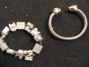 lot 348 image: U.S. Postal charm bracelet , cable cuff bracelet with lion heads