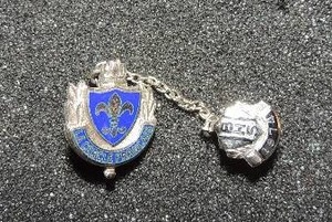 lot 372 image: Sterling silver BHS Bell high school 1974 sweater pincharm