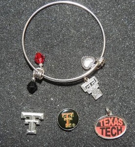 lot 370 image: Texas Tech bracelet with TT and heart 3 lapel tech pins