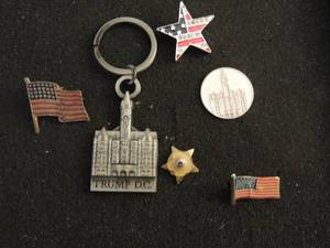 lot 365 image: .925 flag for necklace, Trump hotel medallion 1 Trump DC keychain, lapel pins flags