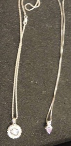 lot 363 image: Sterling .999 120 oz. guardian angel coin on chain from Haltoms Jewlery, Amethyst & silver setting on chain