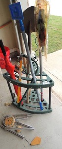 lot 224 image: Green yard organizer with shovel, saw,umbrella yard rack
