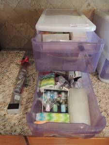 lot 145 image: Stackable totes with face cream and more