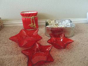 lot 206 image: Plastic red bowls, silver tin full of ribbon, red  ceramic Santa bag