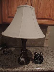 lot 103 image: West Cox alarm clock    brass bedside lamp with shade