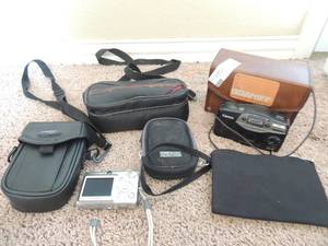 lot 77 image: Digital Canon camera in case   Canon Espit camera with film   Sure shot camera