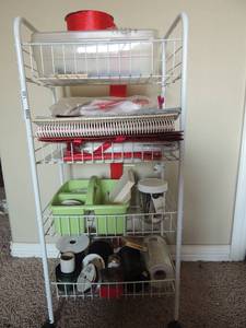 lot 140 image: 4 tier white rolling basket full of craft items
