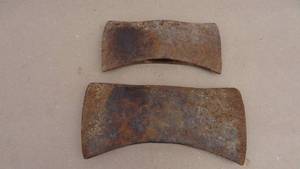 lot 25 image: Lot of 2 double axe heads, one marked Evansville and the other marked Plumb