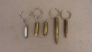 lot 74 image: Lot of 5 bullet key chains