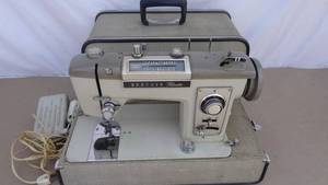 lot 125 image: Vintage Brother Pace Setter sewing machine with case and foot pedal