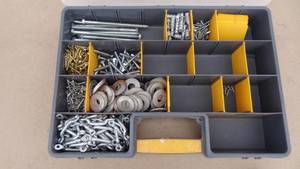 lot 243 image: Container of miscellaneous bolts, screwa, washers, wall anchors, and pull handles