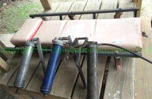 lot 374 image: Torin Big Red mechanics creeper and three grease guns