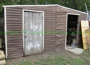 lot 274 image: Galvanized metal panel storage shed, wood frame interior 8.25ft x 16ft x 8ft
