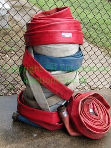 lot 135 image: Commercial water hoses with fittings attached