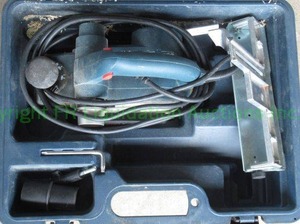 lot 304 image: Bosch 1594 portable planer