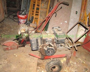 lot 205 image: Dayton portable utility motor and Briggs & Stratton lawn edger