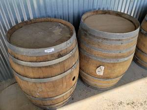 lot 60 image: 2 WhiskeyWine Barrels ( W 26 x H 35 approx.) High end Designer barrels great for outdoor tables.