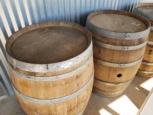 lot 59 image: 2 WhiskeyWine Barrels ( W 26 x H 35 approx.) High end designer barrels great for outdoor tables
