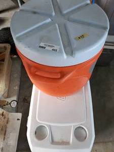 lot 405 image: 2 Water Coolers  1 - Rubbermaid 76 Gallon Model 1655, 1 - Coleman 70 Gallon Coastal Extreme
