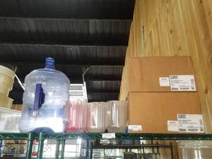 lot 199 image: Assorted Plastic Water Pitchers, 24 Restaurant Pitchers(12 still in original boxes), 1- 5gal. Water Jug