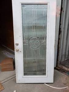 lot 472 image: Solid Exterior Door with Decorative Star Inset  (36 x 77.5)