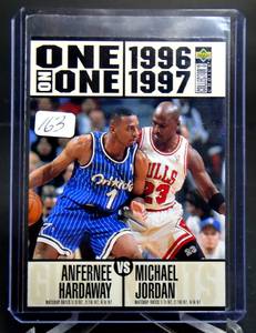 lot 163 image: MICHAEL JORDAN ANFERNEE HARDAWAY 1996-97 COLLECTORS CHOICE ONE ON ONE 356 BULLS