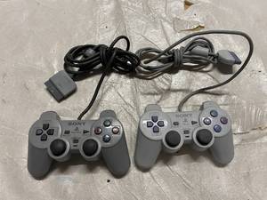 lot 102 image: 2 Sony Playstation Controllers
