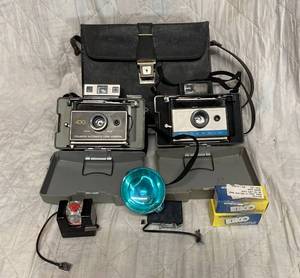 lot 182 image: 2 Polaroid Cameras, accessories and leather carrying case
