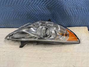 lot 237 image: NIB Headlight (possibly Ford)