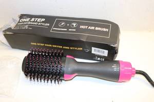 lot 100 image: One Step Hair Dryer and Brush (Blows hot air through brush, works)