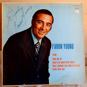 lot 161 image: PERSONALIZED AND SIGNED FARON YOUNG ALBUM