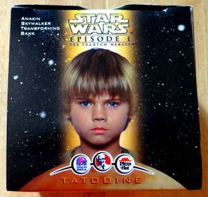 lot 224 image: 1999 Taco-Bell Star Wars Episode 1 Tatooine Anakin Skywalker Transforming Bank - NIB