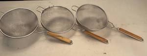 lot 35 image: 3 9.5 diameter Mesh Strainers with handles