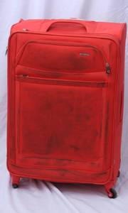 lot 36 image: Orange Suitcase Medium