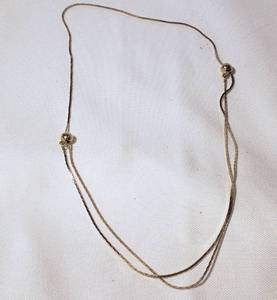 lot 26 image: Adjustable Gold Necklace  Beads move to adjust length