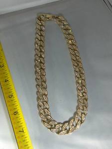lot 61 image: 18 GOLD TONE CUBAN LINK NECKLACE WITH STONES NOT TESTED