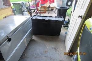 lot 30 image: LARGE BLACK PLASTIC STORAGE CONTAINER-6 REAR WHEELS, 45 LONG X 21 WIDE X 24 TALL