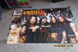 lot 132 image: PANTERA FULL SIZE POSTER, SIGNED PROMO PICTURE, SIGNED PANIC AT THE DISCO POSTER, AND HARD ROCK MENU