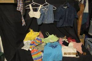 lot 128 image: MISSES AND PETITE CROP, AND HALF TOP AND VESTS-VARIOUS, SIZES ARE MEDIUM MOST SHOW MID DRIFF AND HAVE SHOULDER STRAPS