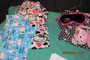 lot 138 image: HELLO KITTY-PAJAMA PANTS-3 PAIR, SIZE MEDIUM, HOTTIE SLEEPING MASK, AND EAR MUFFS