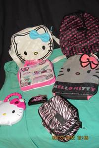 lot 140 image: HELLO KITTY-LEATHER PURSE-WHITE, 2 EA MINI PACKS, MAKE UP BAG, SIN CITY KITTY CLUTCH, OTHER